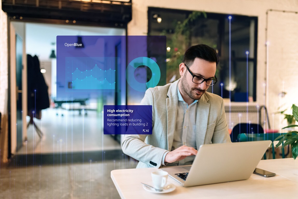 Image of a man working at a laptop